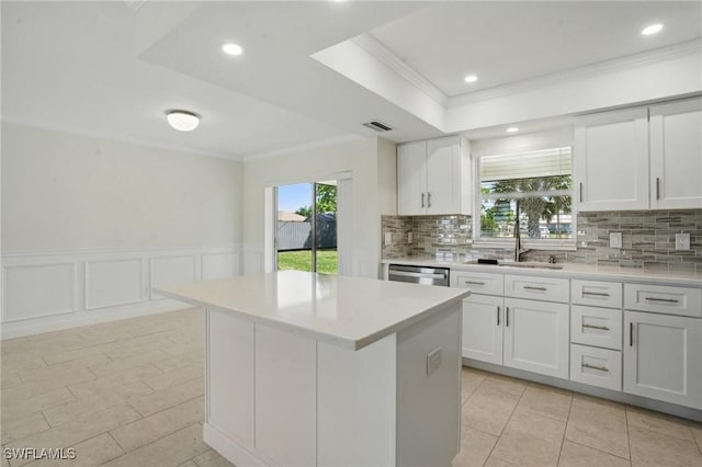 2203 SE Santa Barbara Pl, Cape Coral, FL 33990 - kitchen with visible vents, ornamental molding, light countertops, and dishwasher