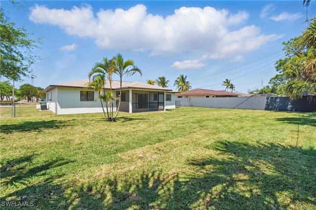 2203 SE Santa Barbara Pl, Cape Coral, FL 33990 - view of yard featuring a sunroom and fence