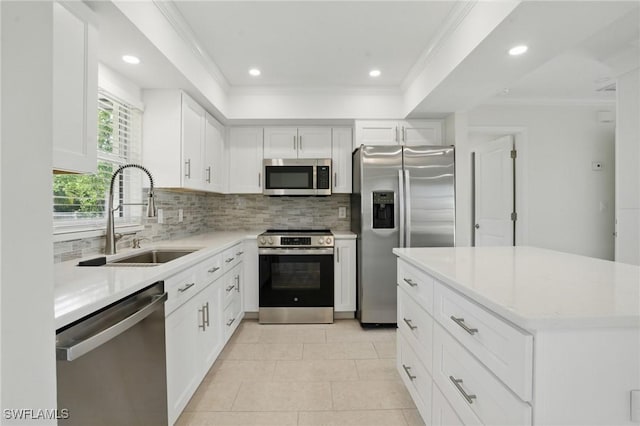 2203 SE Santa Barbara Pl, Cape Coral, FL 33990 - kitchen featuring ornamental molding, appliances with stainless steel finishes, light countertops, a sink, and decorative backsplash