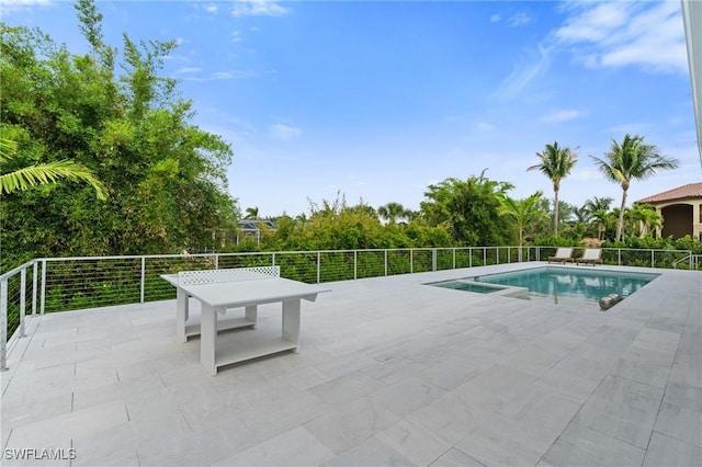 view of swimming pool with a fenced in pool and a patio area