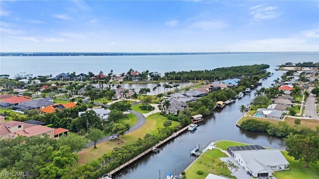 bird's eye view featuring a residential view and a water view