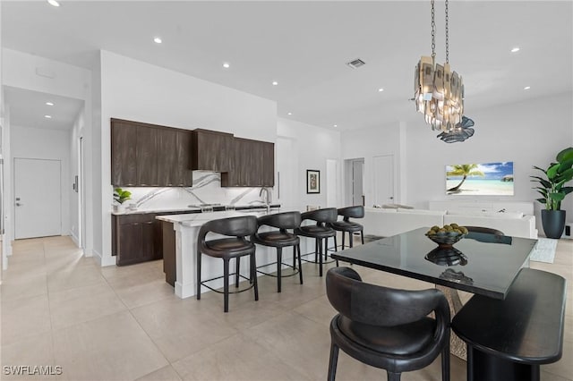dining room with a chandelier, visible vents, and recessed lighting