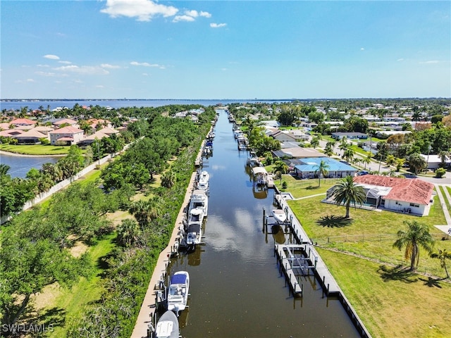 birds eye view of property featuring a water view and a residential view