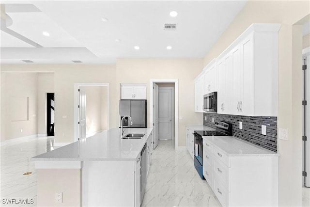 kitchen featuring tasteful backsplash, a sink, white cabinetry, stainless steel appliances, and marble finish floor