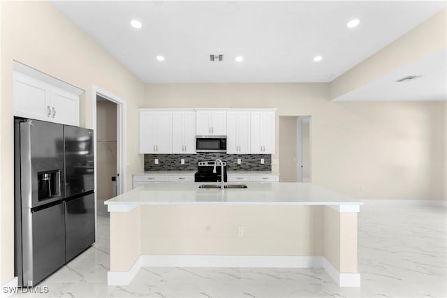 kitchen with visible vents, marble finish floor, a sink, and appliances with stainless steel finishes