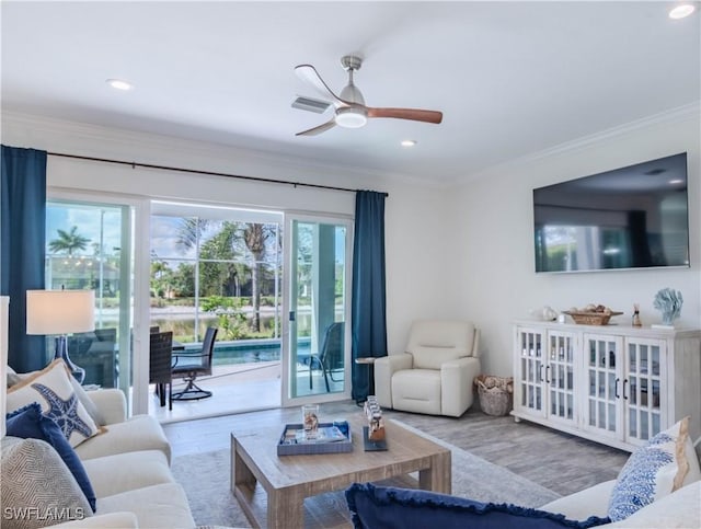 14696 Indigo Lakes Cir, Naples, FL 34119 - living room with recessed lighting, wood finished floors, a ceiling fan, and ornamental molding