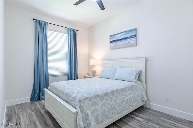 14696 Indigo Lakes Cir, Naples, FL 34119 - bedroom with wood finished floors, baseboards, and ceiling fan