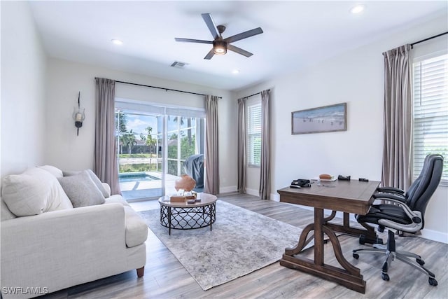 14696 Indigo Lakes Cir, Naples, FL 34119 - home office with baseboards, visible vents, recessed lighting, light wood-style floors, and ceiling fan