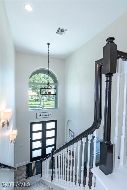 14696 Indigo Lakes Cir, Naples, FL 34119 - entrance foyer with recessed lighting, stairway, visible vents, and french doors