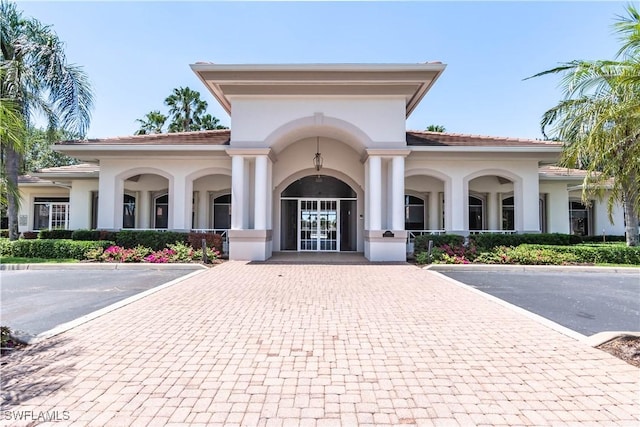 14696 Indigo Lakes Cir, Naples, FL 34119 - view of property with uncovered parking
