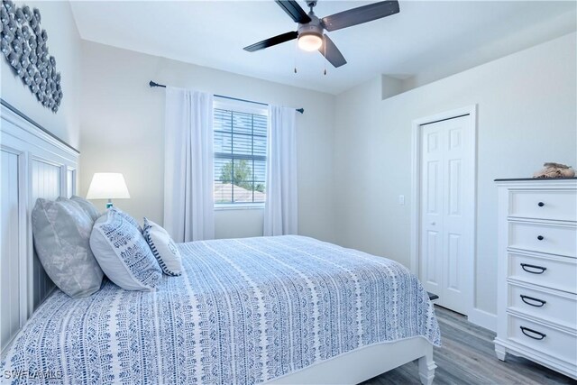 14696 Indigo Lakes Cir, Naples, FL 34119 - bedroom featuring wood finished floors, a ceiling fan, and baseboards