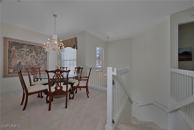 2165 Arielle Dr Unit 1605, Naples, FL 34109 - dining area with light carpet, baseboards, and an inviting chandelier