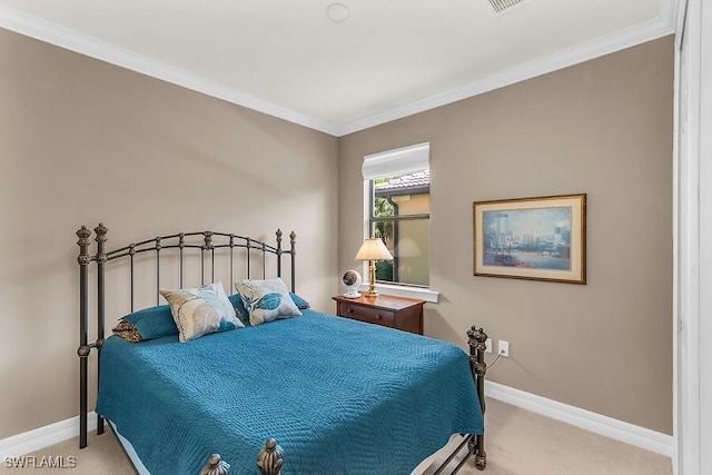bedroom featuring carpet flooring, baseboards, ornamental molding, and visible vents