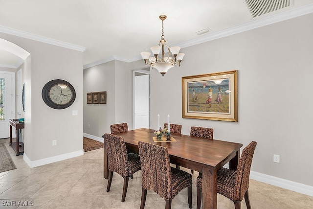 dining area featuring arched walkways, a notable chandelier, visible vents, and crown molding