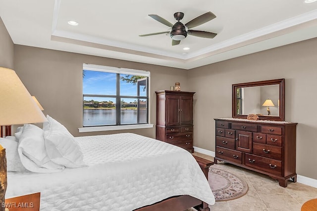 bedroom featuring ornamental molding, baseboards, recessed lighting, and a raised ceiling