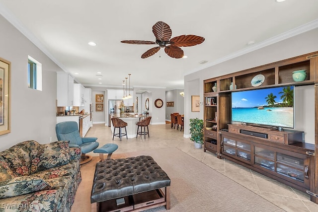 living room featuring light tile patterned floors, a ceiling fan, ornamental molding, recessed lighting, and baseboards