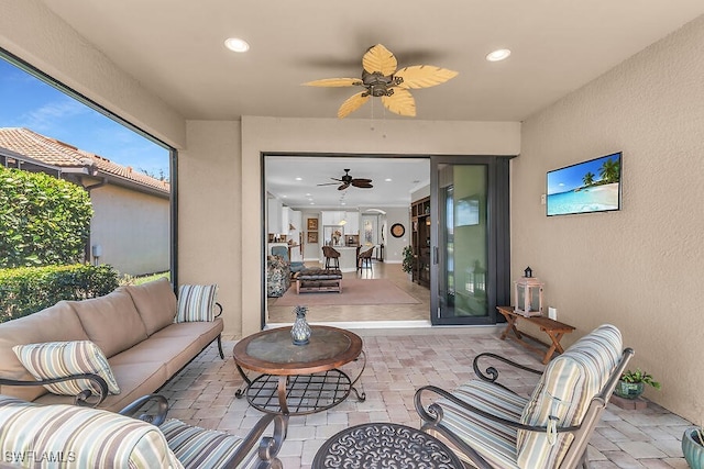 view of patio with an outdoor hangout area and a ceiling fan