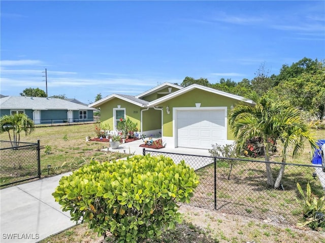 1938 Lillie St, Fort Myers, FL 33916 - ranch-style home with an attached garage, driveway, and stucco siding