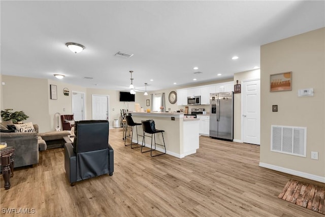 1938 Lillie St, Fort Myers, FL 33916 - living room with light wood-type flooring, recessed lighting, and baseboards