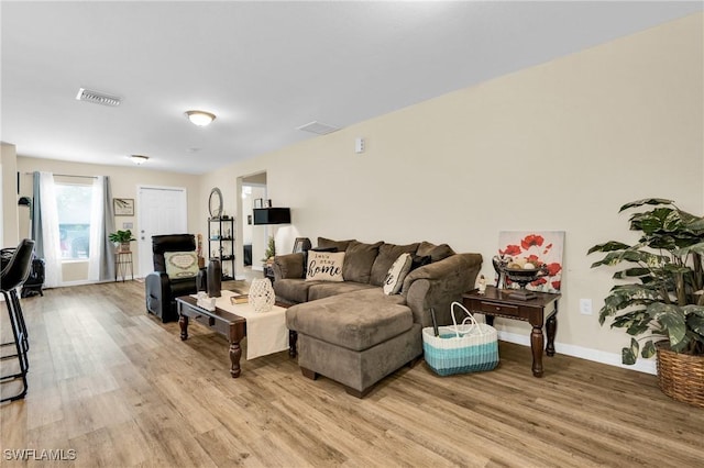 1938 Lillie St, Fort Myers, FL 33916 - living room featuring light wood-style floors and baseboards