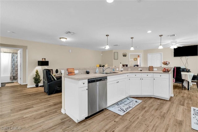 1938 Lillie St, Fort Myers, FL 33916 - kitchen with dishwasher, open floor plan, light wood finished floors, a sink, and light countertops