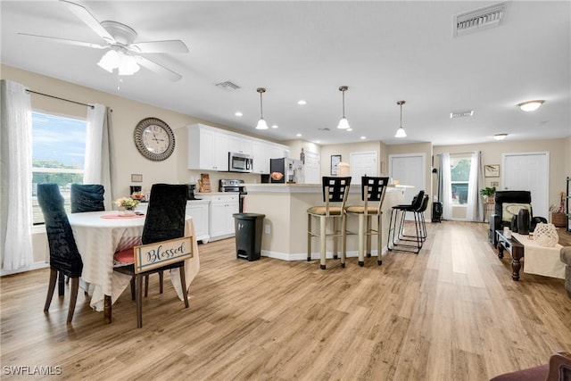 1938 Lillie St, Fort Myers, FL 33916 - dining room featuring light wood-style floors, recessed lighting, ceiling fan, and baseboards