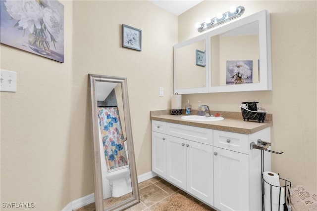 1938 Lillie St, Fort Myers, FL 33916 - bathroom featuring vanity, tile patterned flooring, and baseboards