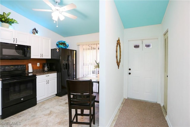 4030 Northlight Dr, Naples, FL 34112 - kitchen featuring white cabinets, ceiling fan, dark countertops, and black appliances