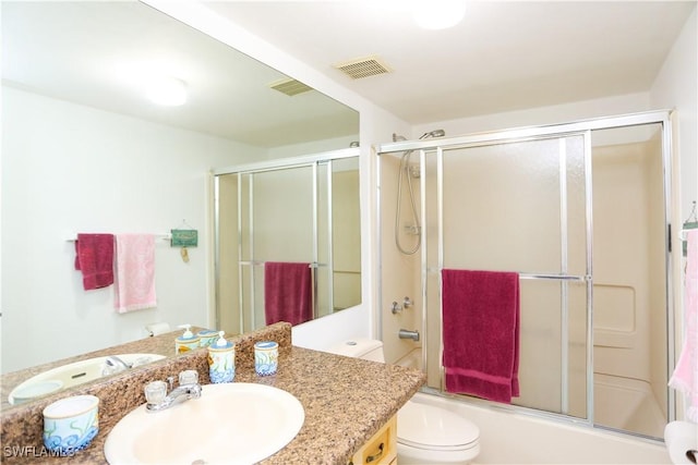 4030 Northlight Dr, Naples, FL 34112 - bathroom with visible vents, vanity, shower / bath combination with glass door, and toilet