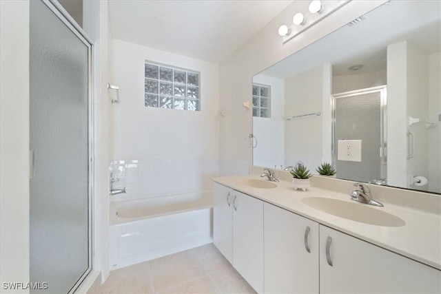 6560 Huntington Lakes Cir Unit 102, Naples, FL 34119 - bathroom featuring a bath, a stall shower, a sink, and tile patterned flooring