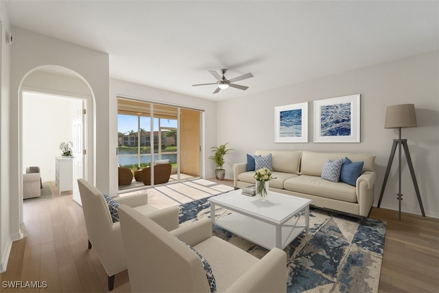 6560 Huntington Lakes Cir Unit 102, Naples, FL 34119 - living room featuring wood finished floors, ceiling fan, and baseboards