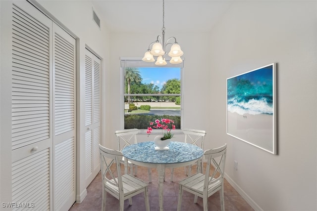 6560 Huntington Lakes Cir Unit 102, Naples, FL 34119 - dining space with a chandelier, tile patterned floors, baseboards, and visible vents