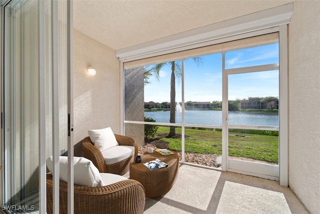 6560 Huntington Lakes Cir Unit 102, Naples, FL 34119 - sunroom / solarium with a textured wall and a water view