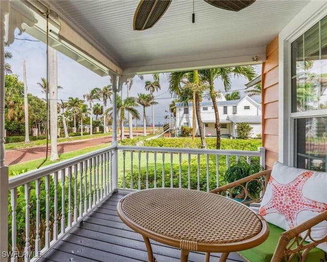 sunroom with a ceiling fan