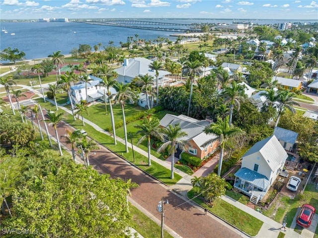 drone / aerial view with a residential view and a water view