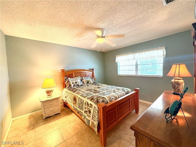 bedroom featuring light tile patterned floors, baseboards, ceiling fan, and visible vents