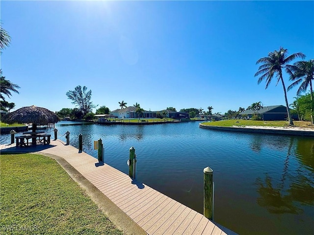 4940 Vincennes St Unit 204, Cape Coral, FL 33904 - dock with a water view and a yard
