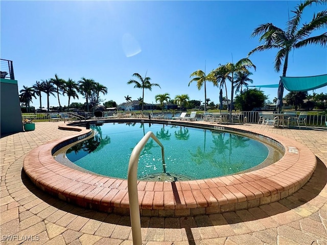 community pool featuring a patio area