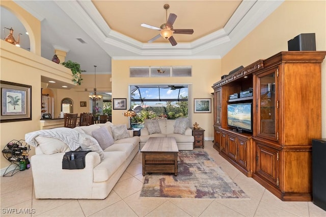 211 Lido Dr, Punta Gorda, FL 33950 - living area featuring visible vents, light tile patterned floors, a high ceiling, ornamental molding, and ceiling fan with notable chandelier