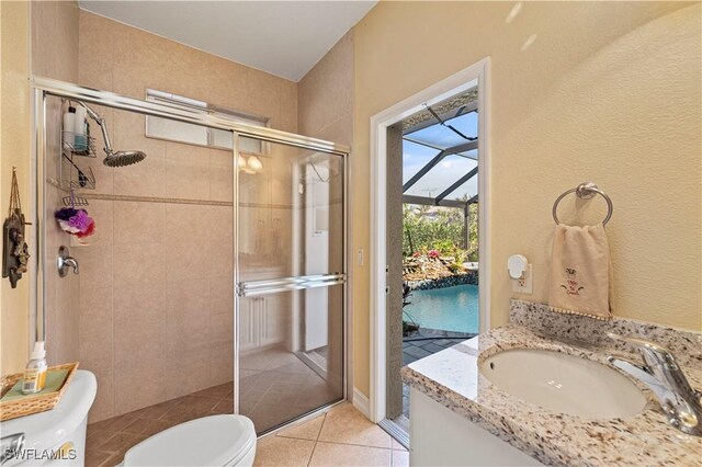 211 Lido Dr, Punta Gorda, FL 33950 - bathroom with a shower stall, tile patterned floors, vanity, and toilet