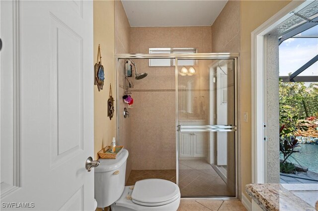 211 Lido Dr, Punta Gorda, FL 33950 - full bath with tile patterned flooring, a stall shower, and toilet