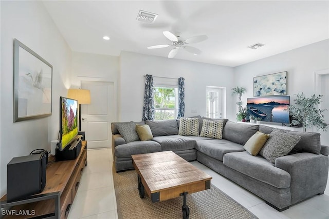 living room featuring light tile patterned floors, ceiling fan, recessed lighting, and visible vents