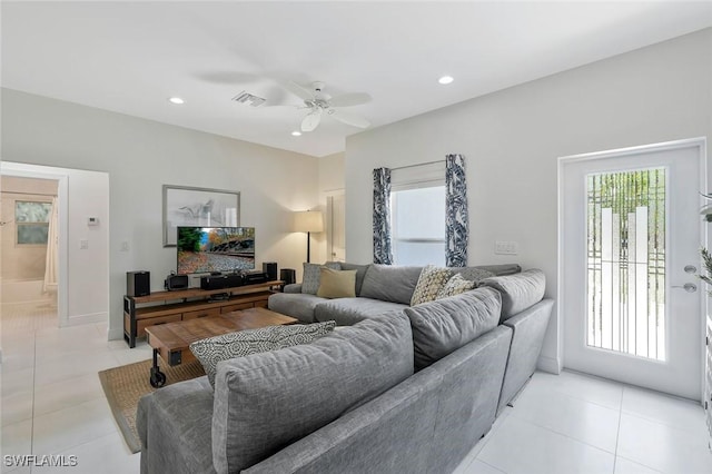 living room featuring recessed lighting, plenty of natural light, ceiling fan, and light tile patterned flooring