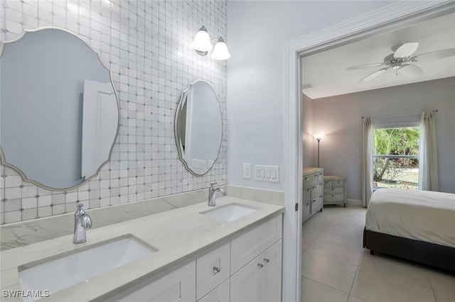 bathroom featuring tile patterned floors, double vanity, and a sink