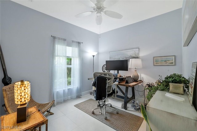tiled home office featuring a ceiling fan