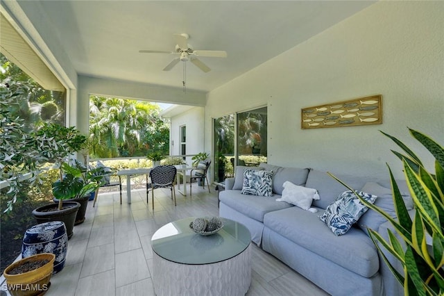 exterior space featuring outdoor dining space, ceiling fan, and an outdoor living space