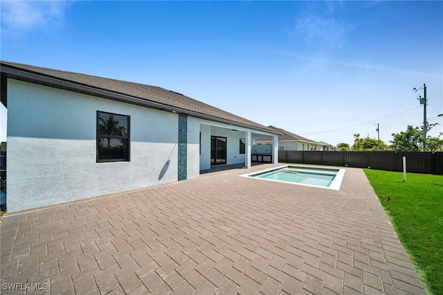 view of pool featuring a patio area, a fenced backyard, and a lawn