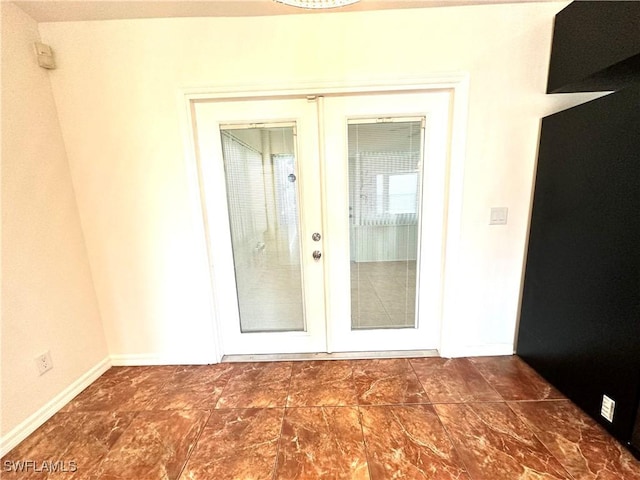 view of exterior entry featuring french doors