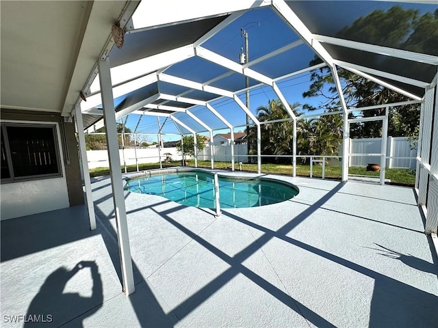 view of pool with a lanai, a fenced backyard, a fenced in pool, and a patio area