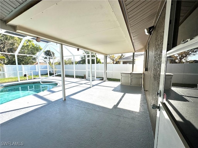 view of pool featuring a fenced in pool, a patio, a fenced backyard, a lanai, and an outbuilding